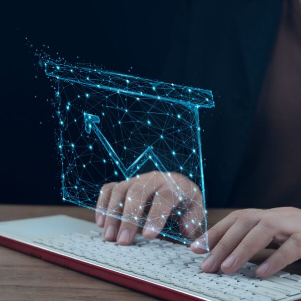 data icon overlaid over person typing on keyboard